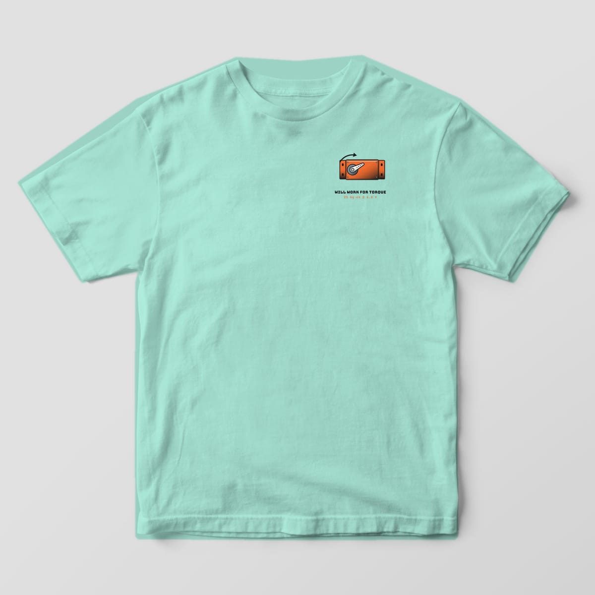 Front of a chalky mint Comfort Colors 1717 tee with a small orange servo with a torque arrow on the left chest.