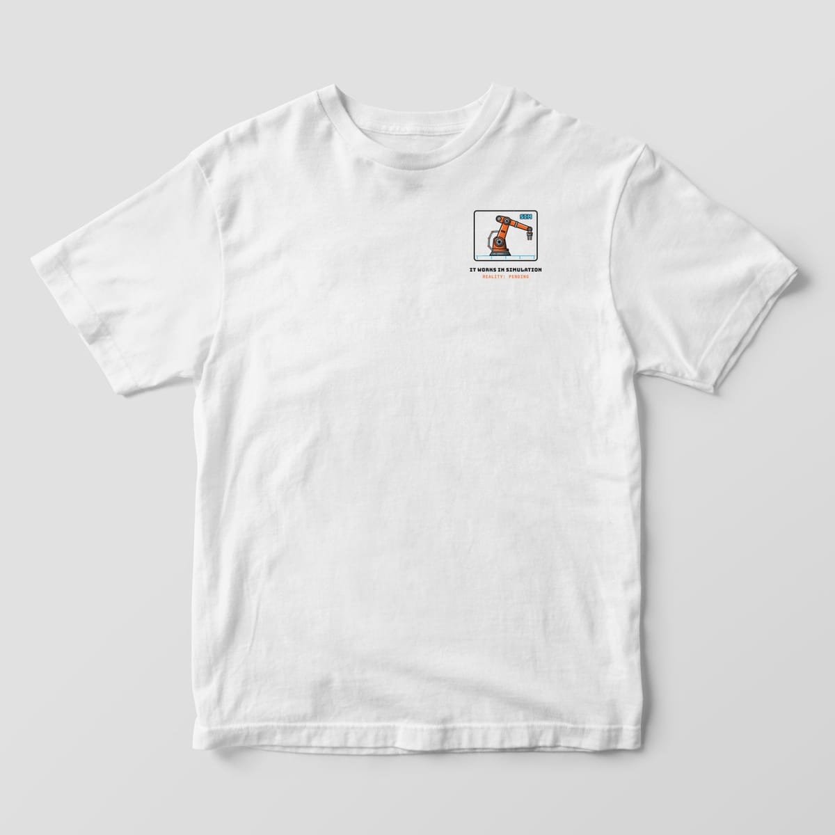Front of a white Comfort Colors 1717 tee with a small robot arm in a simulation window on the left chest.