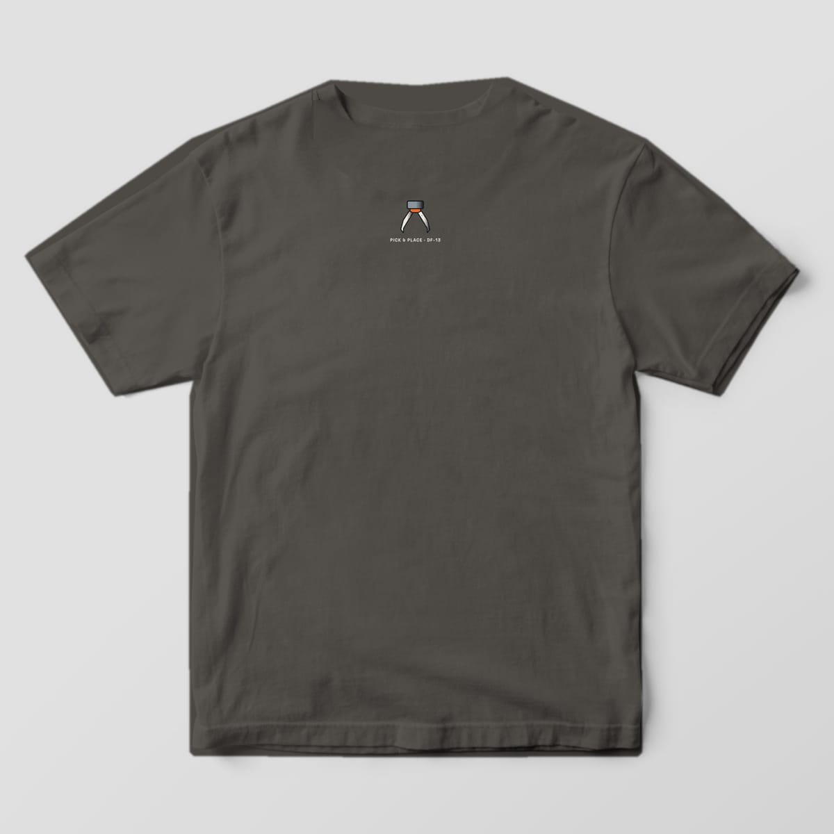 Back of a pepper Comfort Colors 1717 tee with a small claw icon at the back neck.