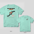 Chalky Mint tee shown back and front: back has an orange line-following robot on a curving black track under Stay on Track; front has a small robot on a track.