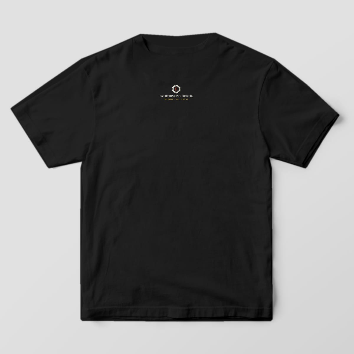 Back of a black Comfort Colors 1717 tee with a small gear monogram neck print below the collar.