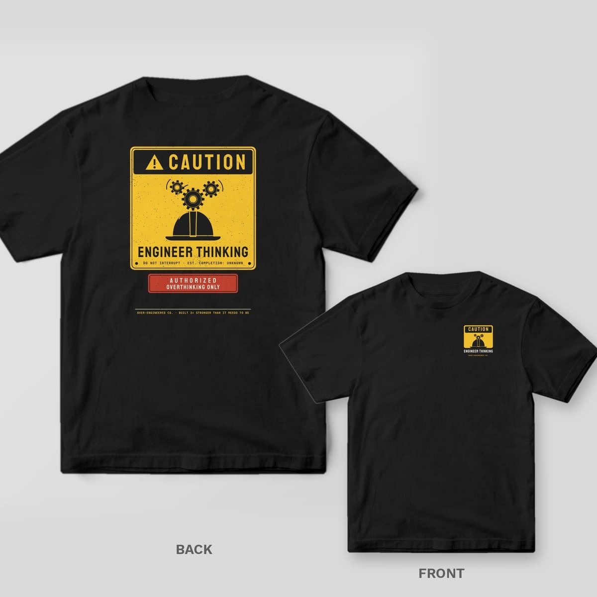 Black tee shown back and front: back has a big yellow Caution sign with a hard hat and gears reading Engineer Thinking; front has a small yellow Caution sign with a hard hat.