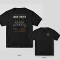 Black tee shown back and front: back has a Pratt truss bridge diagram with loads and reactions under the words Load Tested; front has a small cream and yellow truss icon.