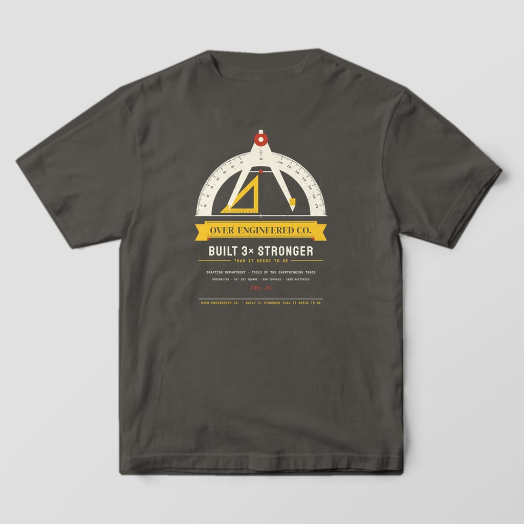 Back of a pepper Comfort Colors 1717 tee with a protractor, set square and compass crest with an Over-Engineered Co. ribbon.
