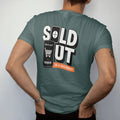 Man wearing a Blue Spruce tee, seen from the back: a frozen countdown clock and a phone with an empty cart under Sold Out and In 4 Seconds, as a two-ink streetwear graphic in off-white and orange.