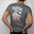 Man wearing a Pepper tee, seen from the back: a scuffed sneaker with a frayed lace splashing a puddle under a rain cloud, labeled Beaters Only and Rainy Day Rotation, as a two-ink streetwear graphic in off-white and orange.