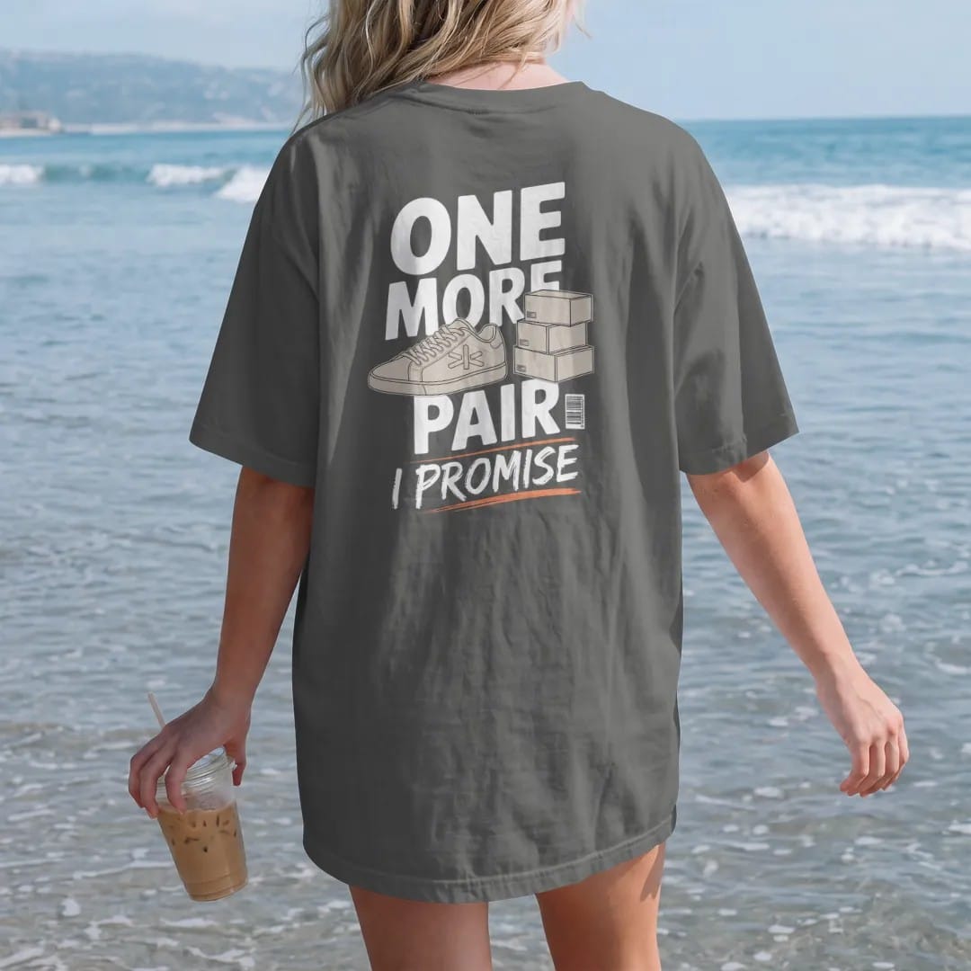 Woman on the beach in a Pepper tee, back view: a sneaker with crossed fingers beside a stack of delivery boxes, labeled One More Pair and a scrawled I Promise, as a two-ink streetwear graphic in off-white and orange.
