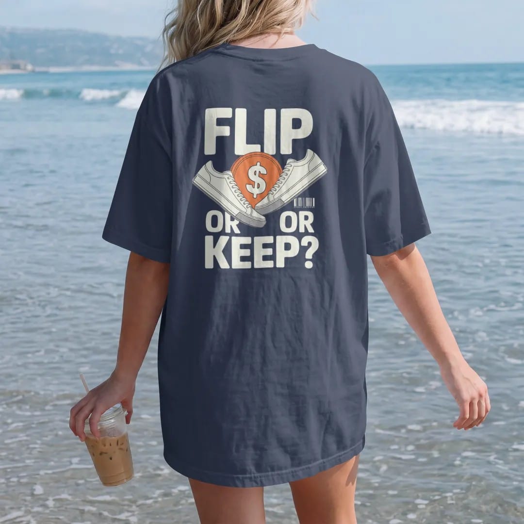 Woman on the beach in a Navy tee, back view: a flipping coin with a sneaker on one face and a dollar sign on the other, flanked by Flip and Or Keep?, as a two-ink streetwear graphic in off-white and orange.
