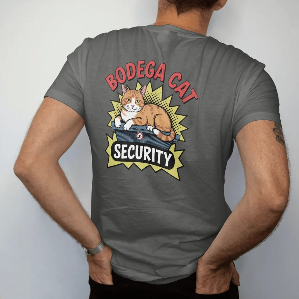 Man wearing a Pepper tee, seen from the back: an orange tabby lounging on a chip rack wearing a security badge, under Bodega Cat and above a Security ribbon, in halftone comic-pop red, yellow and cream.