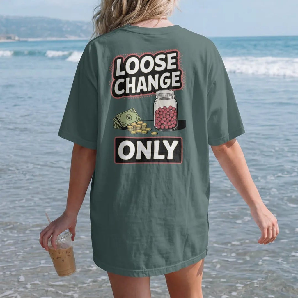 Woman on the beach in a Blue Spruce tee, back view: a pile of coins and a crumpled bill beside a candy jar on a counter under Loose Change and Only, in halftone comic-pop red, yellow and cream.