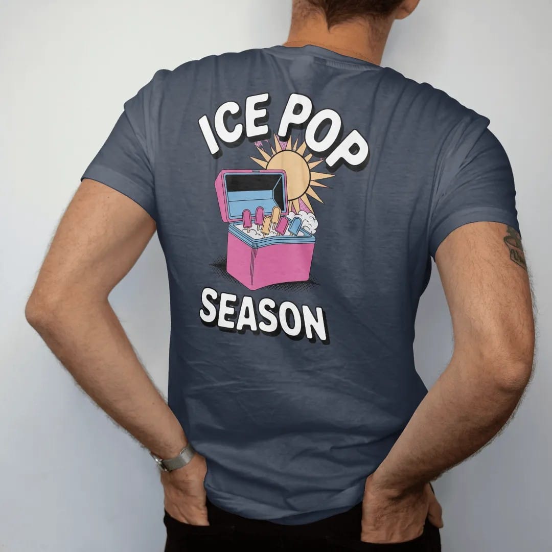 Man wearing a Midnight tee, seen from the back: an open ice-pop freezer with colorful popsicles and frosty mist under a big sun, with melting Ice Pop and Season, in halftone comic-pop pink, yellow and cream.