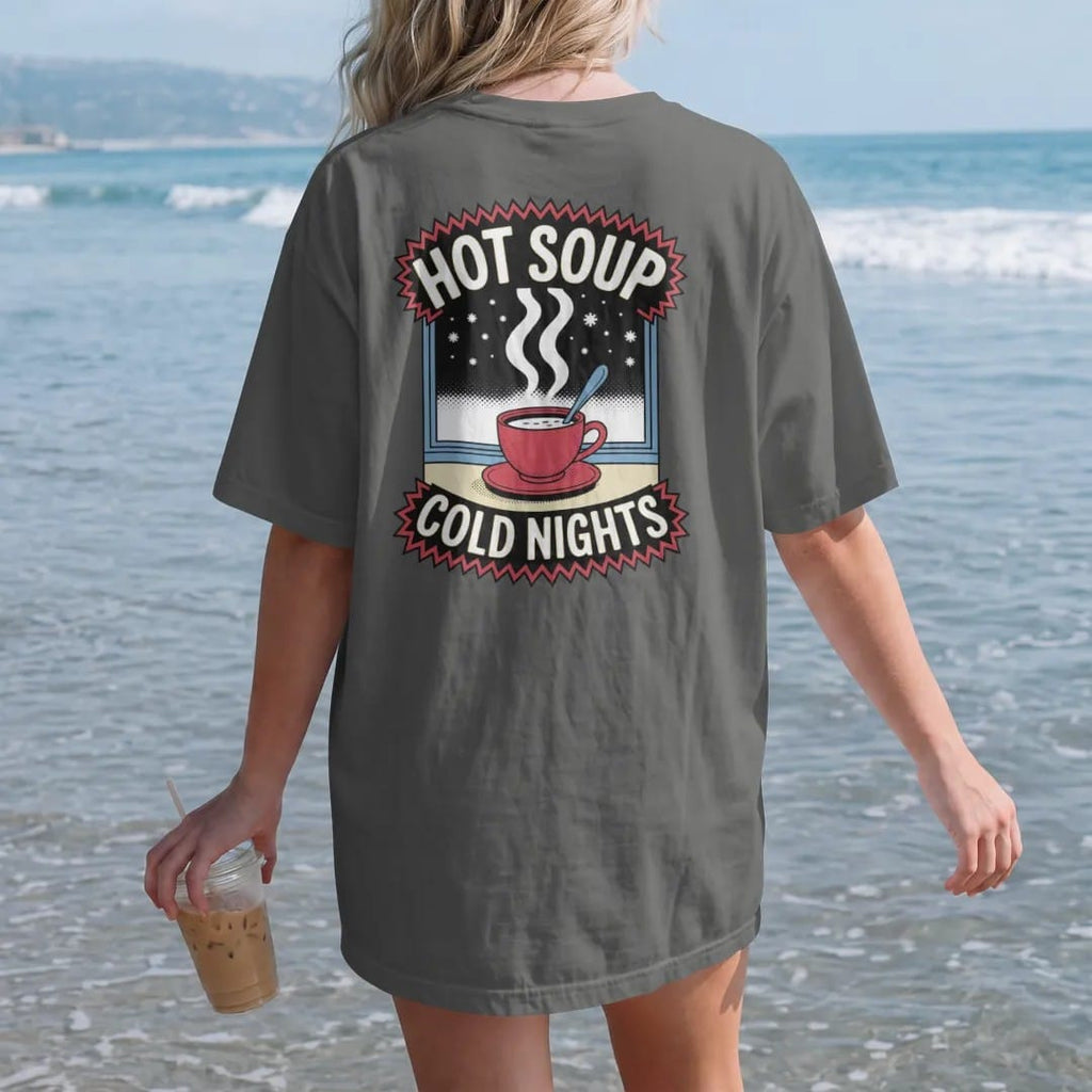 Woman on the beach in a Pepper tee, back view: a steaming soup cup with a spoon in front of a frosted window with falling snow, under Hot Soup and Cold Nights, in halftone comic-pop red, yellow and cream.