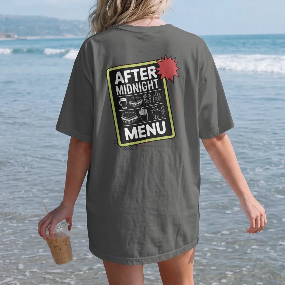 Woman on the beach in a Pepper tee, back view: a chalkboard menu with doodled sandwich, coffee, chips and cat under the header After Midnight and Menu, in halftone comic-pop red, yellow and cream.
