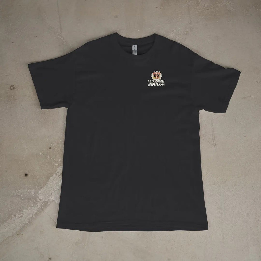 Front of a Black tee laid flat, with the small Late Night Bodega logo on the left chest.