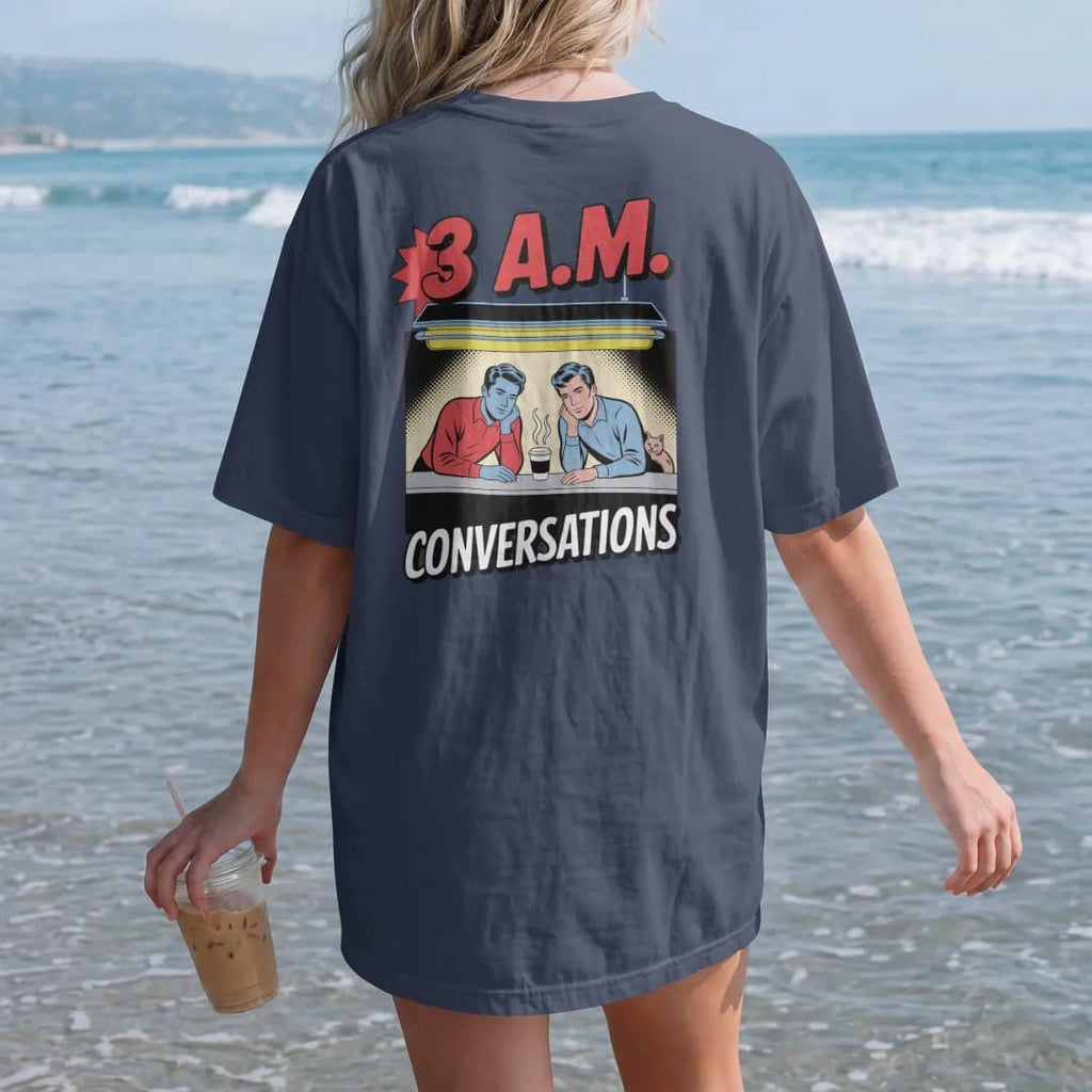 Woman on the beach in a Navy tee, back view: two figures leaning on a counter under a fluorescent light with steaming coffees and a listening cat, under 3 A.M. and Conversations, in halftone comic-pop red, yellow and cream.