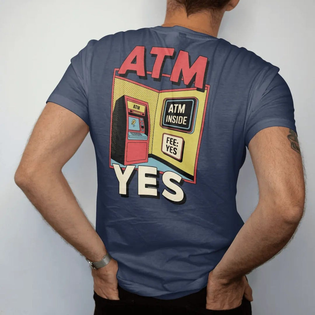 Man wearing a Navy tee, seen from the back: a clunky ATM with a glowing screen and a flying coin under a neon ATM Inside sign and a Fee: Yes placard, in halftone comic-pop red, yellow and cream.