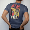 Man wearing a Navy tee, seen from the back: a clunky ATM with a glowing screen and a flying coin under a neon ATM Inside sign and a Fee: Yes placard, in halftone comic-pop red, yellow and cream.
