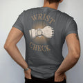 Man wearing a Graphite tee, seen from the back: a forearm wearing a steel wristwatch with camera-flash starburst lines under bold Wrist Check, as a fine engraving in antique gold and cream.