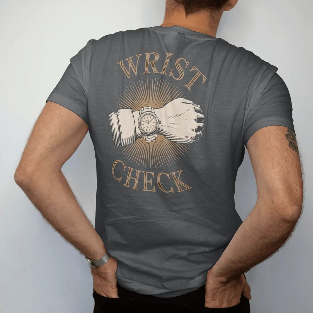Man wearing a Graphite tee, seen from the back: a forearm wearing a steel wristwatch with camera-flash starburst lines under bold Wrist Check, as a fine engraving in antique gold and cream.
