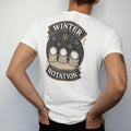 Man wearing a White tee, seen from the back: three watches peeking from sweater cuffs in a row with falling snowflakes, under Winter and Rotation, as a fine engraving in antique gold and cream.
