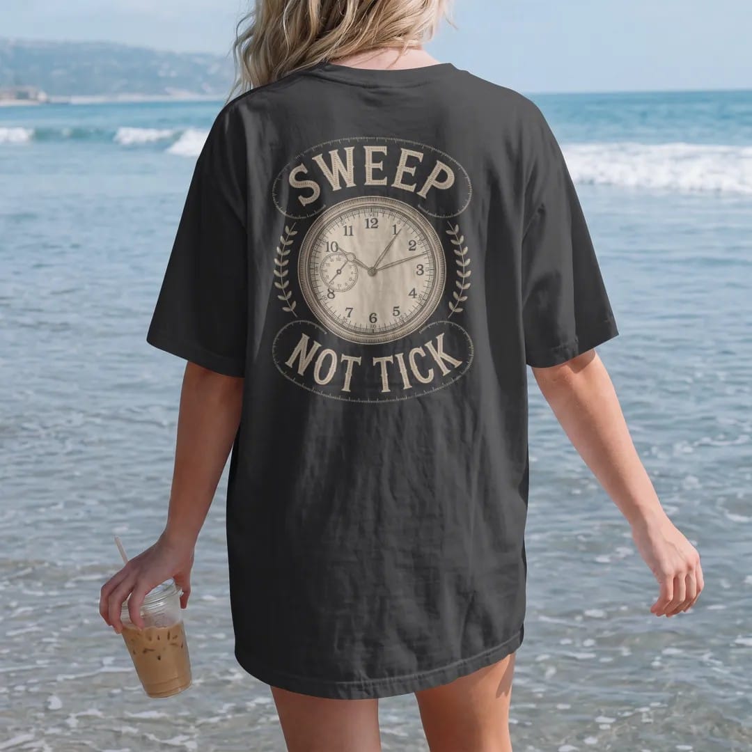 Woman on the beach in a Black tee, back view: a seconds hand with a smooth sweeping trail beside a crossed-out ticking hand, flanked by Sweep and Not Tick, as a fine engraving in antique gold and cream.