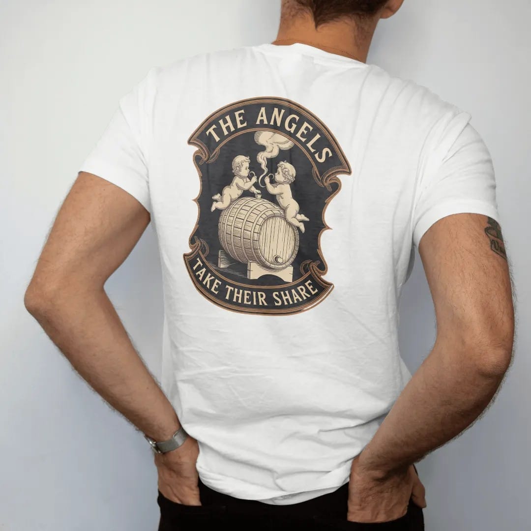 Man wearing a White tee, seen from the back: two engraved cherubs sipping vapor from an oak barrel, with "THE ANGELS" and "TAKE THEIR SHARE" in ornate engraved Didone capitals, printed as a fine engraving in antique gold and warm cream.