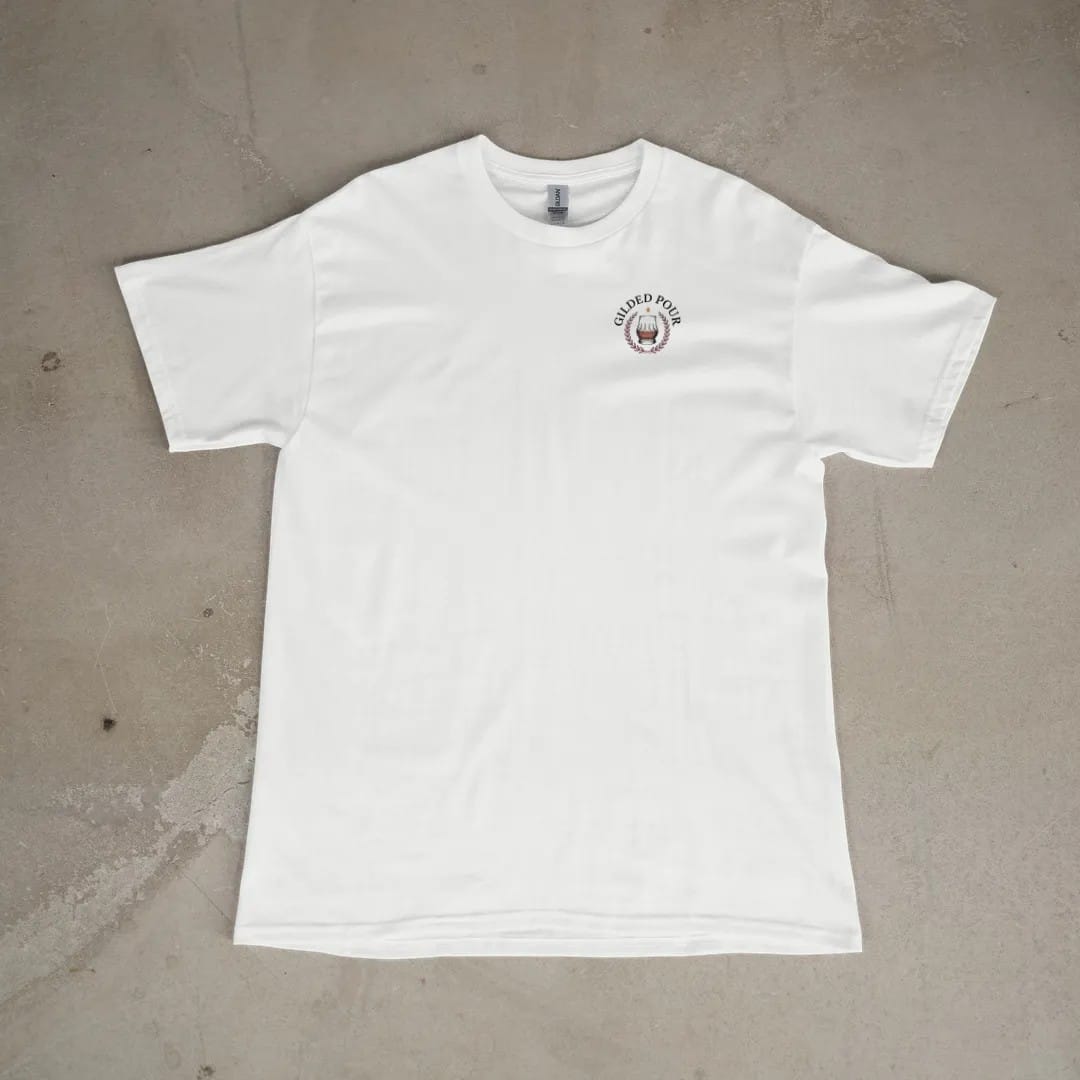 Front of a White tee laid flat, with the small Gilded Pour logo on the left chest.