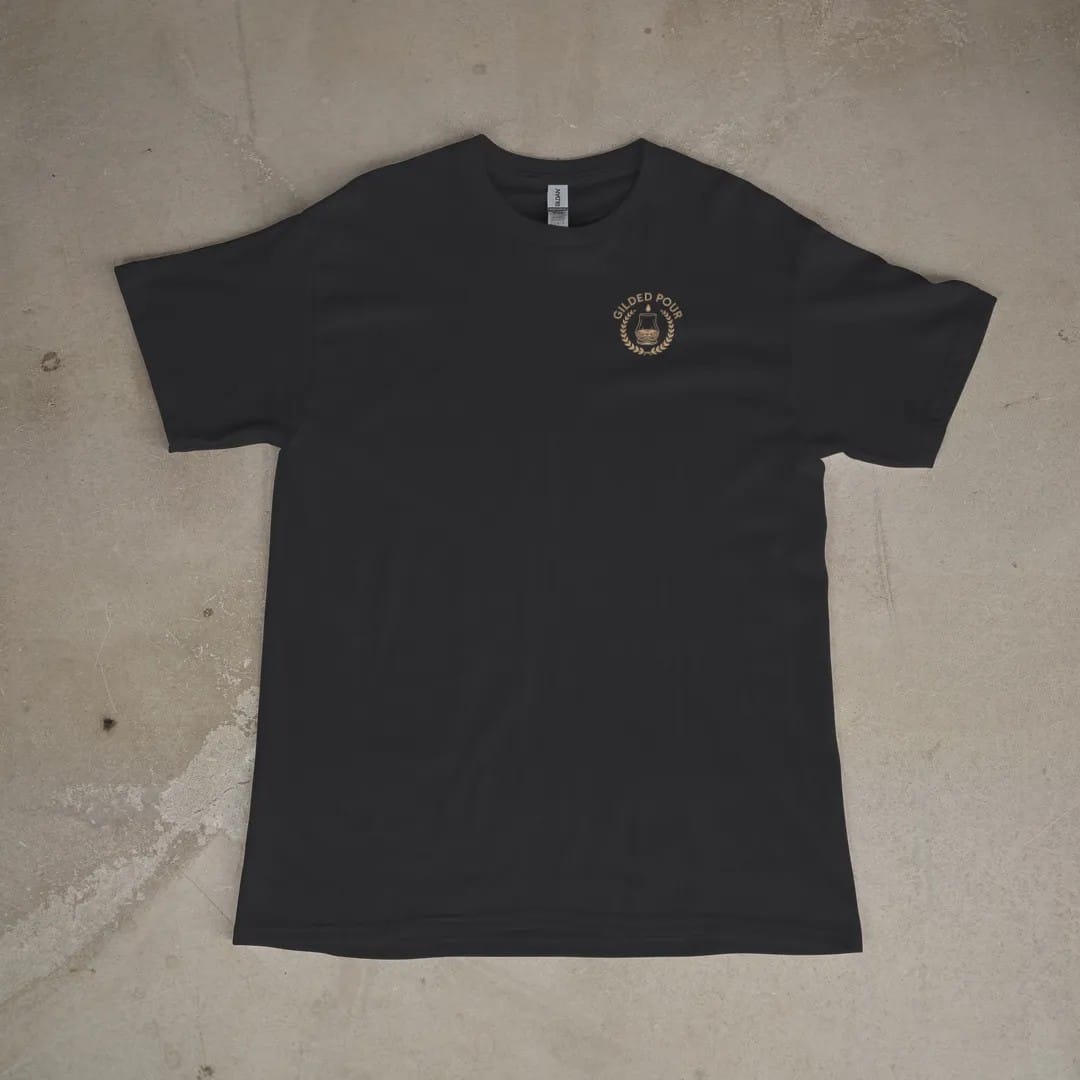 Front of a Black tee laid flat, with the small Gilded Pour logo on the left chest.