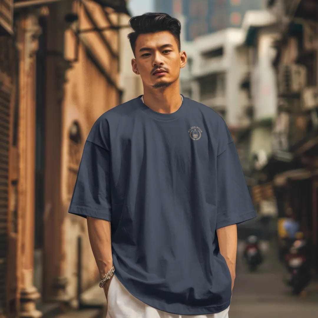Man in a Midnight tee on a city street, with the small Gilded Pour logo on the left chest.