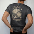 Man wearing a Black tee, seen from the back: a cutaway barrel interior with cracked alligator-skin char, with "CHAR NO. 4" and "ALLIGATOR SKIN", printed as a fine engraving in antique gold and warm cream.