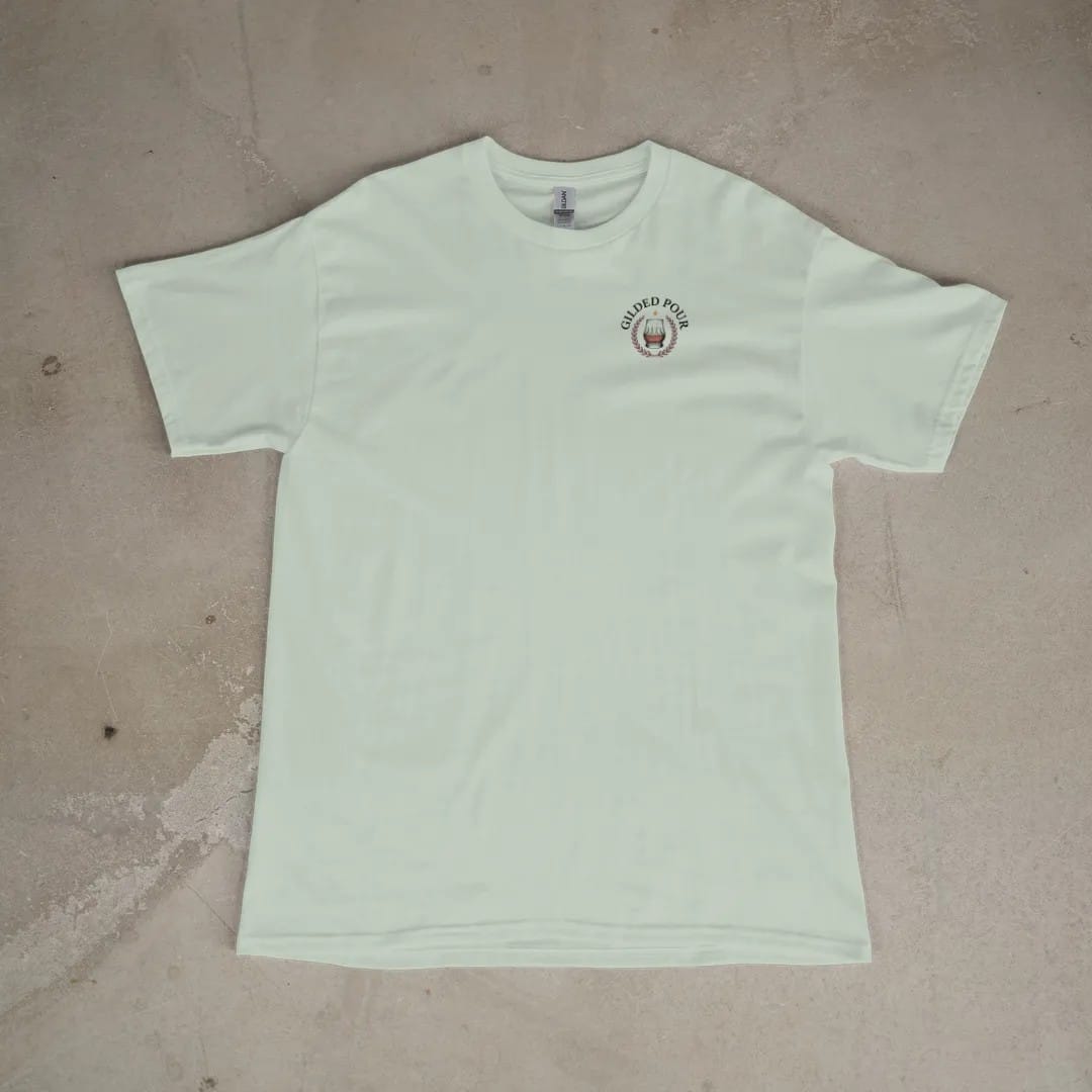 Front of a Bay tee laid flat, with the small Gilded Pour logo on the left chest.
