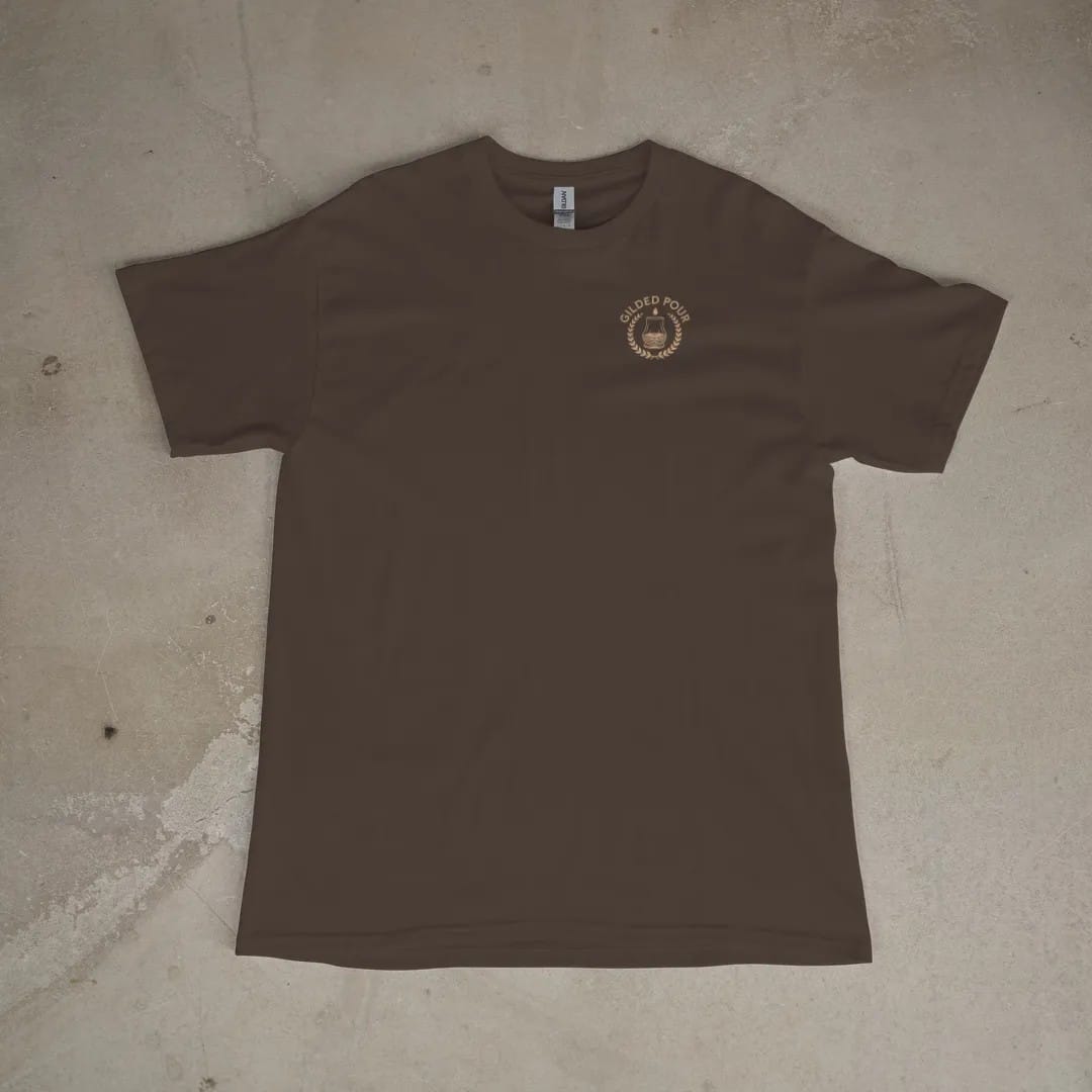 Front of a Espresso tee laid flat, with the small Gilded Pour logo on the left chest.