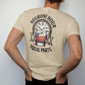 Man wearing a Sandstone tee, seen from the back: a Negroni glass with orange wheel, three jiggers and a clock face, with "NEGRONI HOUR" and "EQUAL PARTS", printed as a fine engraving in oxblood, charred oak brown and antique gold.