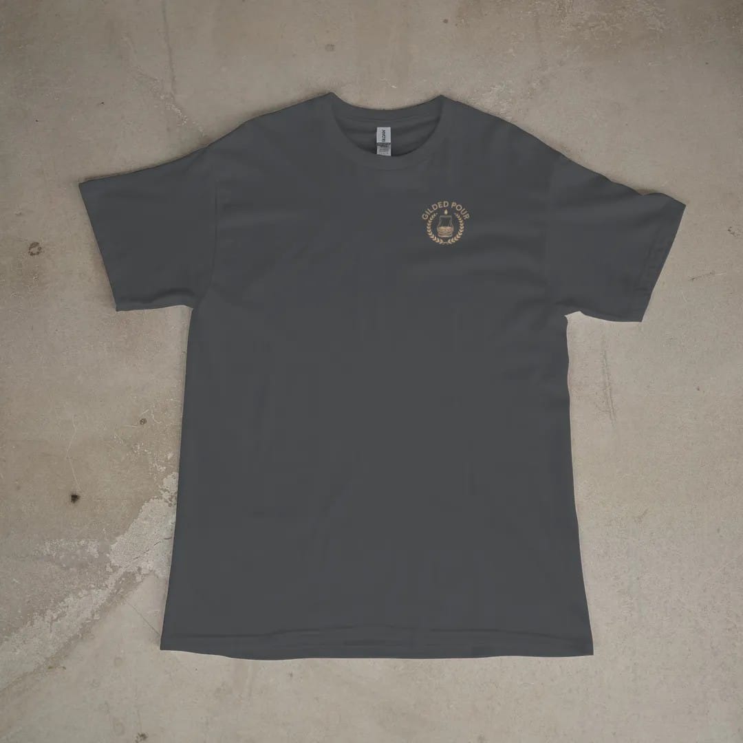 Front of a Graphite tee laid flat, with the small Gilded Pour logo on the left chest.
