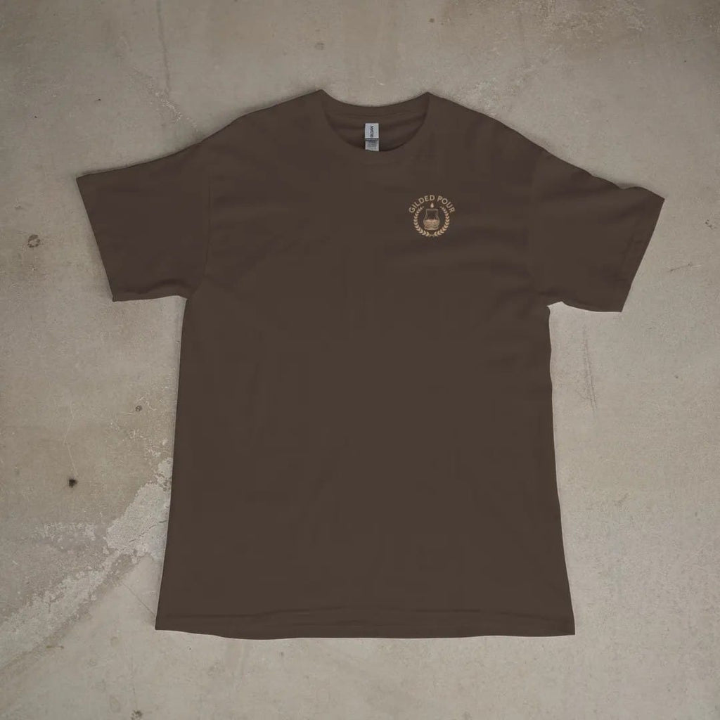 Front of a Espresso tee laid flat, with the small Gilded Pour logo on the left chest.