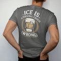 Man wearing a Pepper tee, seen from the back: a rocks glass holding one ice cube wearing a monocle, with "ICE IS", "A PERSONAL CHOICE" and "(WRONG)", printed as a fine engraving in antique gold and warm cream.