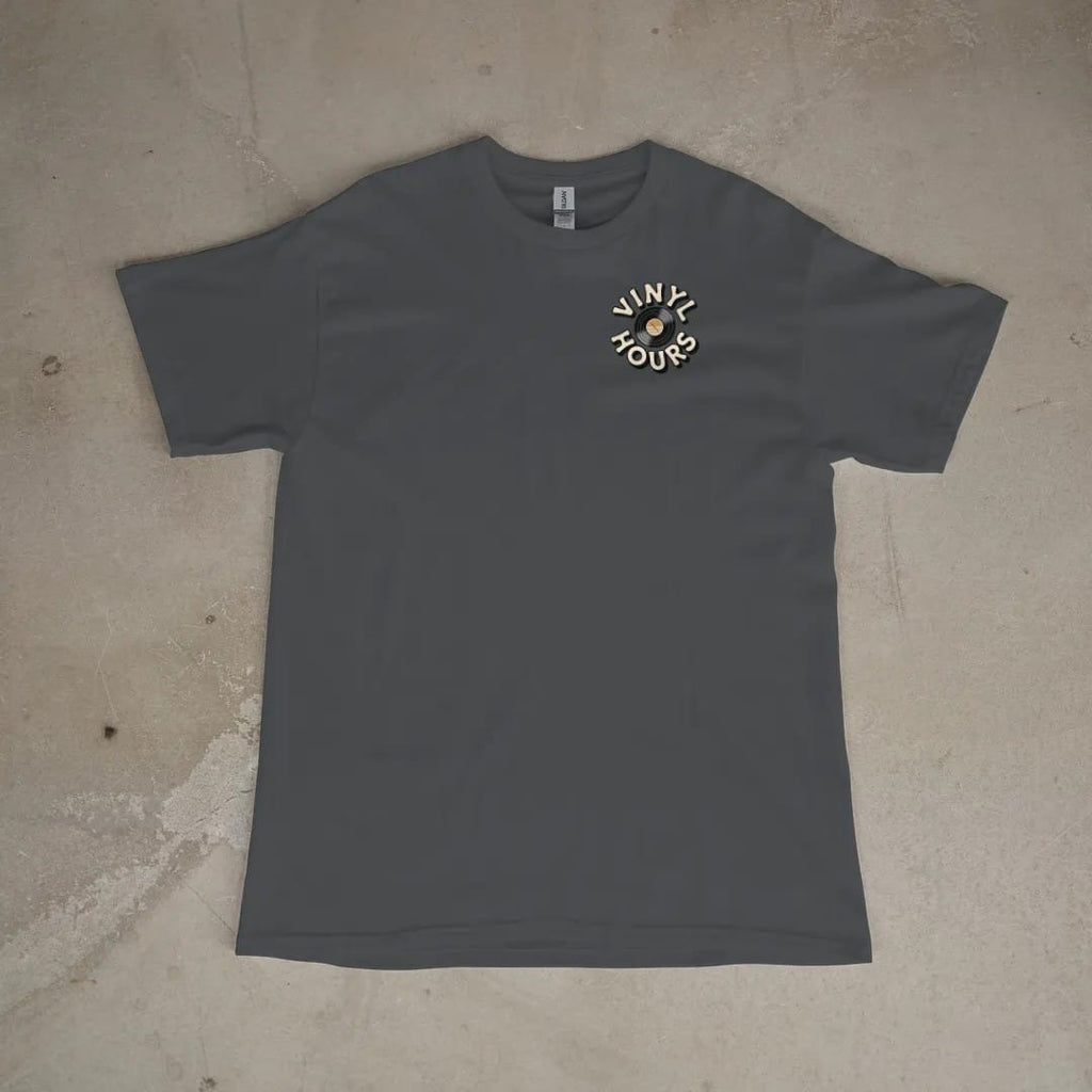 Front of a Graphite tee laid flat, with the small Vinyl Hours logo on the left chest.