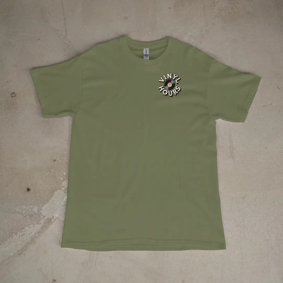 Front of a Moss tee laid flat, with the small Vinyl Hours logo on the left chest.