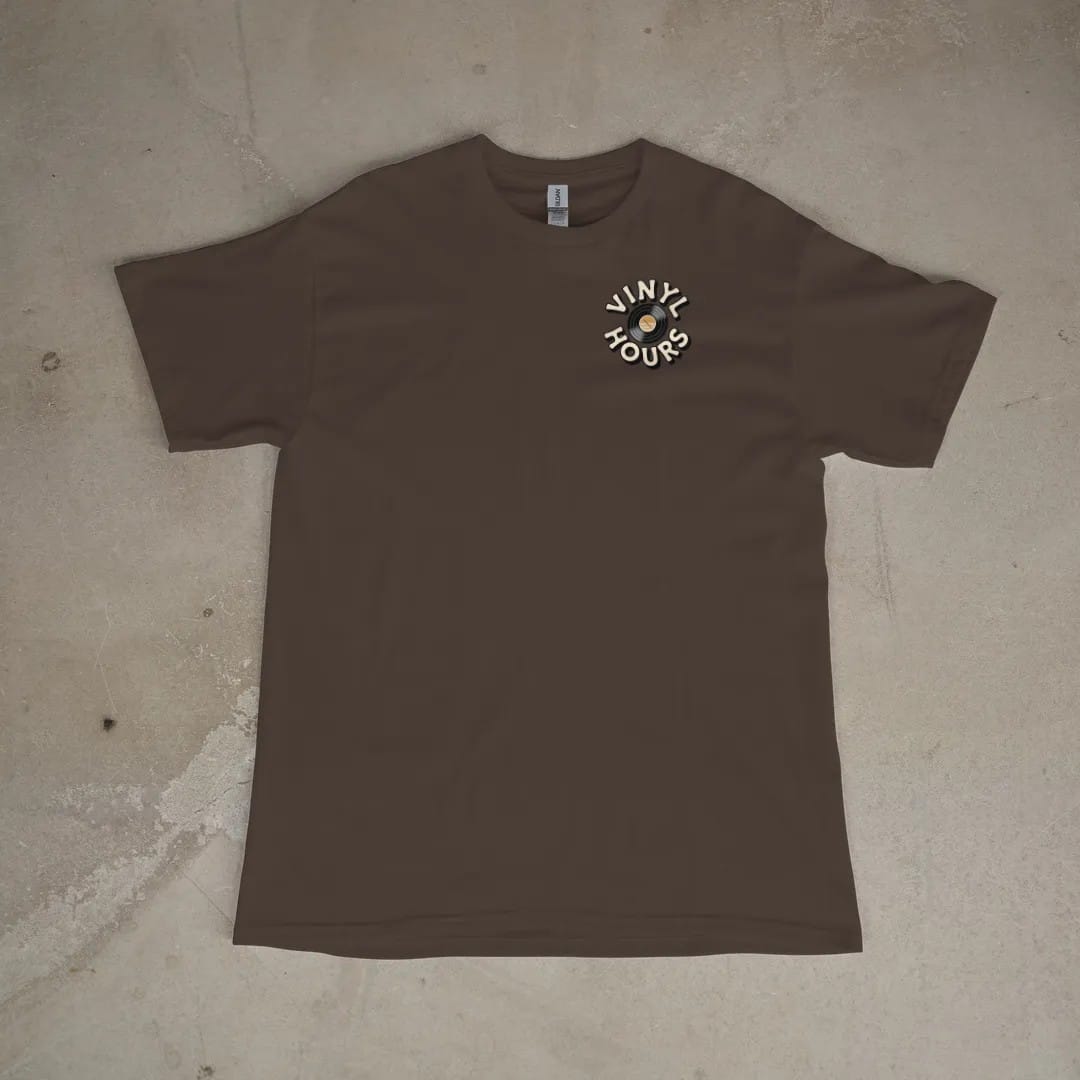 Front of a Espresso tee laid flat, with the small Vinyl Hours logo on the left chest.