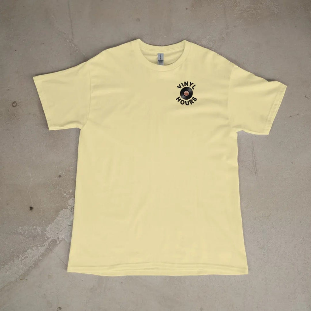 Front of a Butter tee laid flat, with the small Vinyl Hours logo on the left chest.