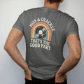 Man wearing a Pepper tee, seen from the back: a spinning record giving off crackle sparks and hiss lines, with "HISS & CRACKLE" and "THAT'S THE GOOD PART" in chunky 70s lettering and small 70s caps, printed in faded, cracked cream, mustard, burnt…