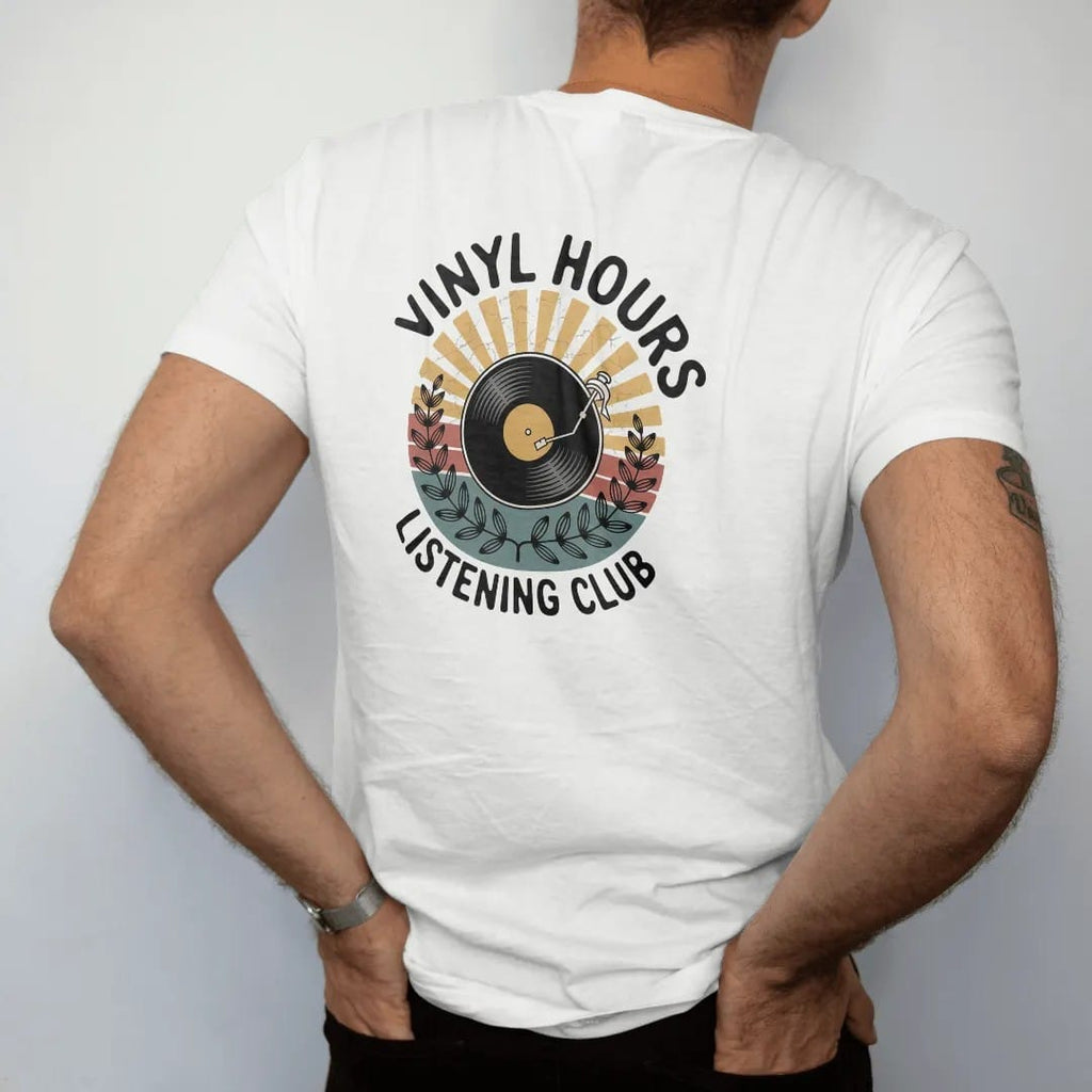 Man wearing a White tee, seen from the back: a round club emblem with a record, tonearm and sunburst rays, with "VINYL HOURS" and "LISTENING CLUB" in chunky 70s lettering and small 70s caps, printed in faded, cracked cream, mustard, burnt orange…