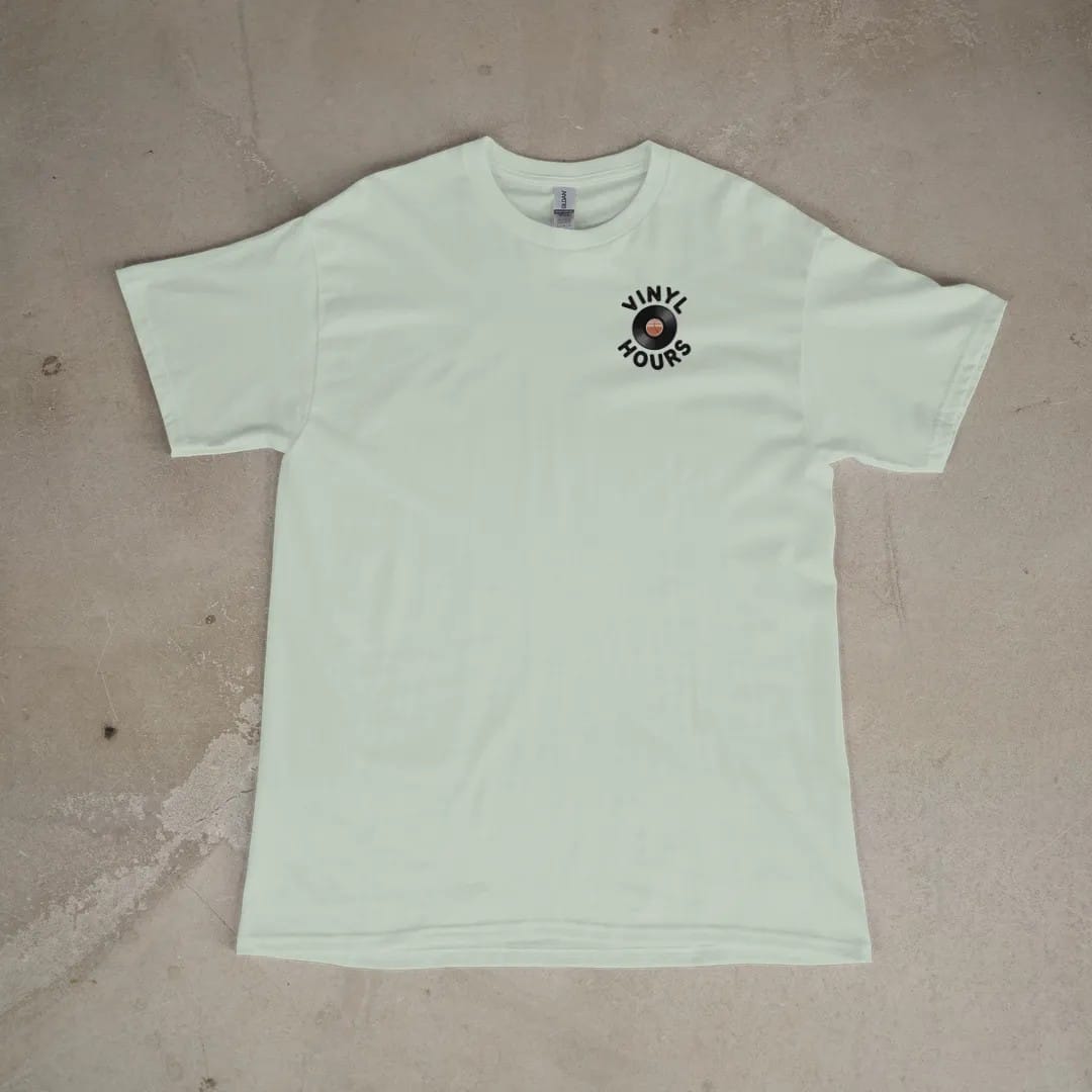 Front of a Bay tee laid flat, with the small Vinyl Hours logo on the left chest.