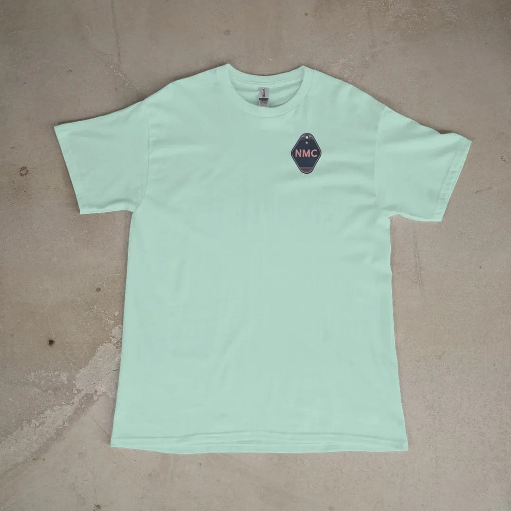 Front of a Chalky Mint tee laid flat, with the small Neon Motor Court logo on the left chest.