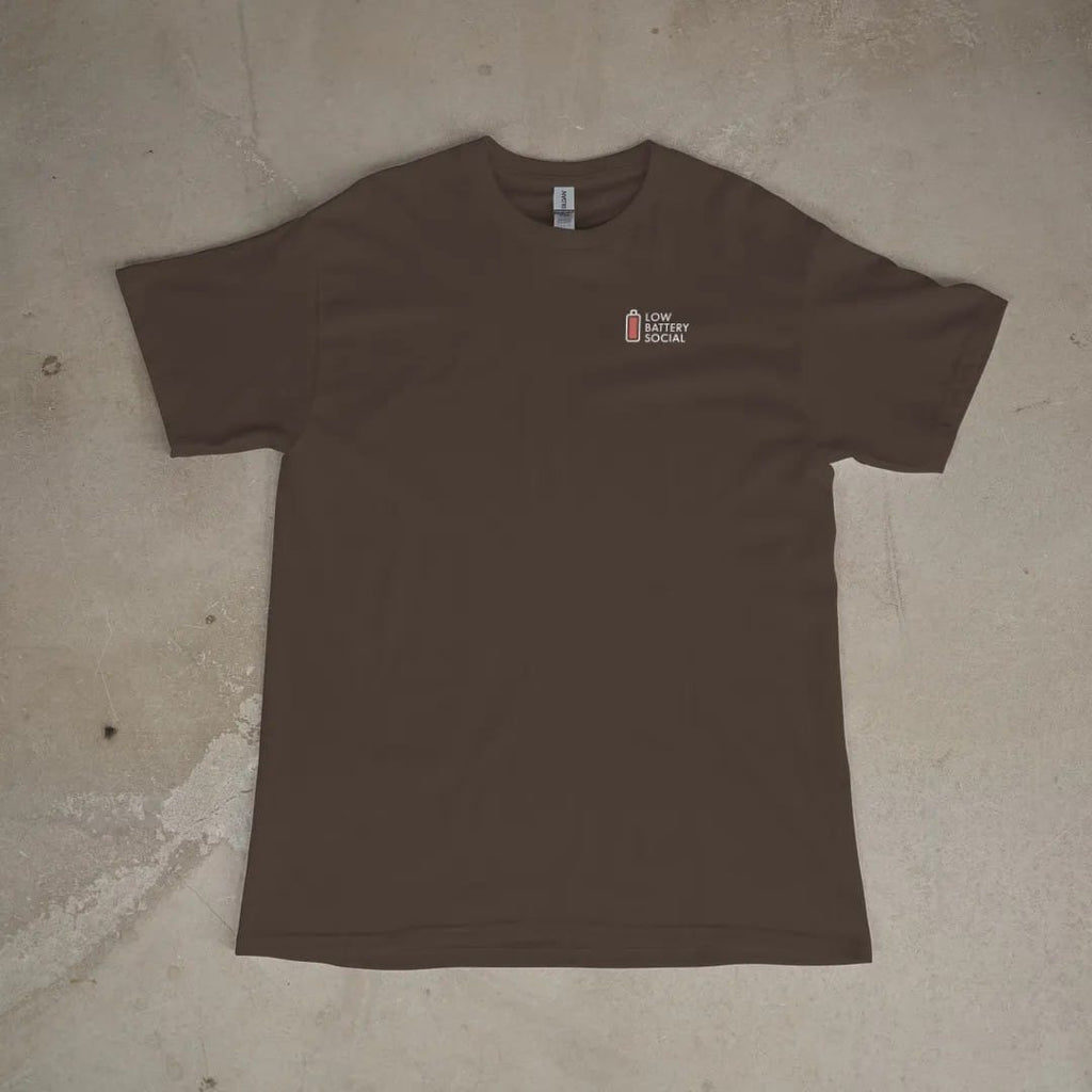 Front of a Espresso tee laid flat, with the small Low Battery Social logo on the left chest.