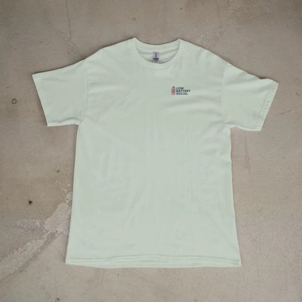 Front of a Bay tee laid flat, with the small Low Battery Social logo on the left chest.