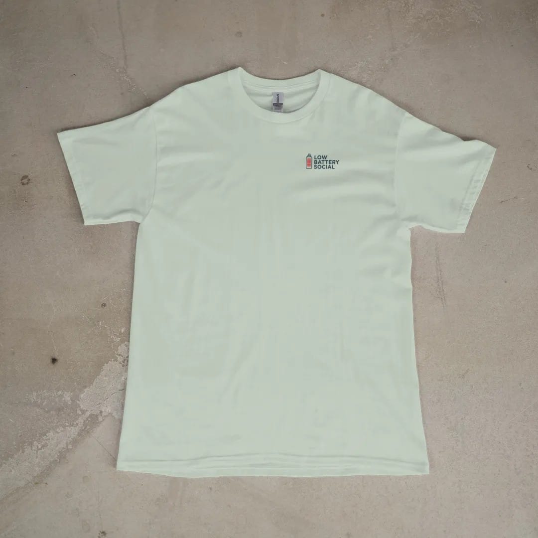 Front of a Bay tee laid flat, with the small Low Battery Social logo on the left chest.