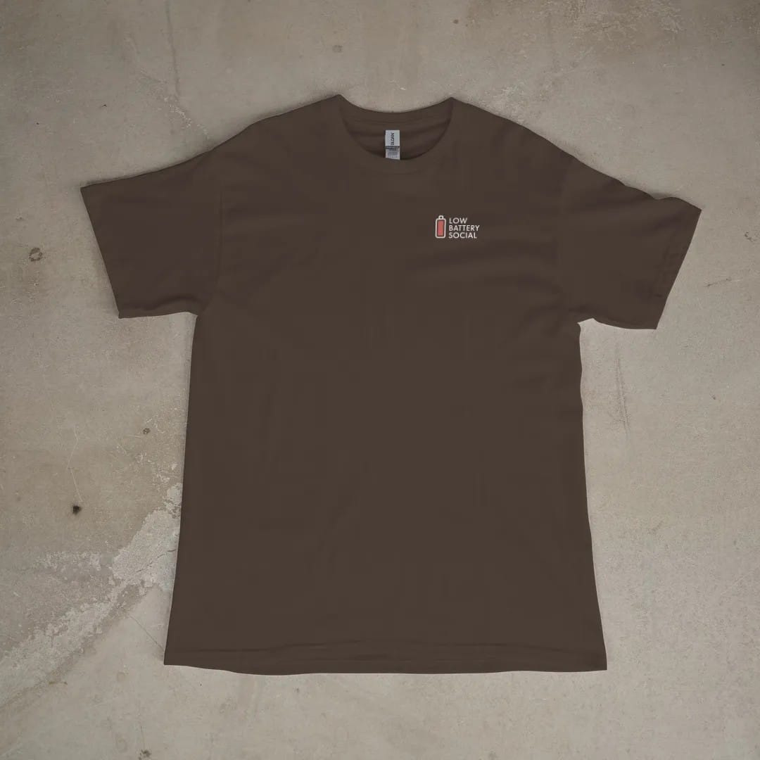 Front of a Espresso tee laid flat, with the small Low Battery Social logo on the left chest.