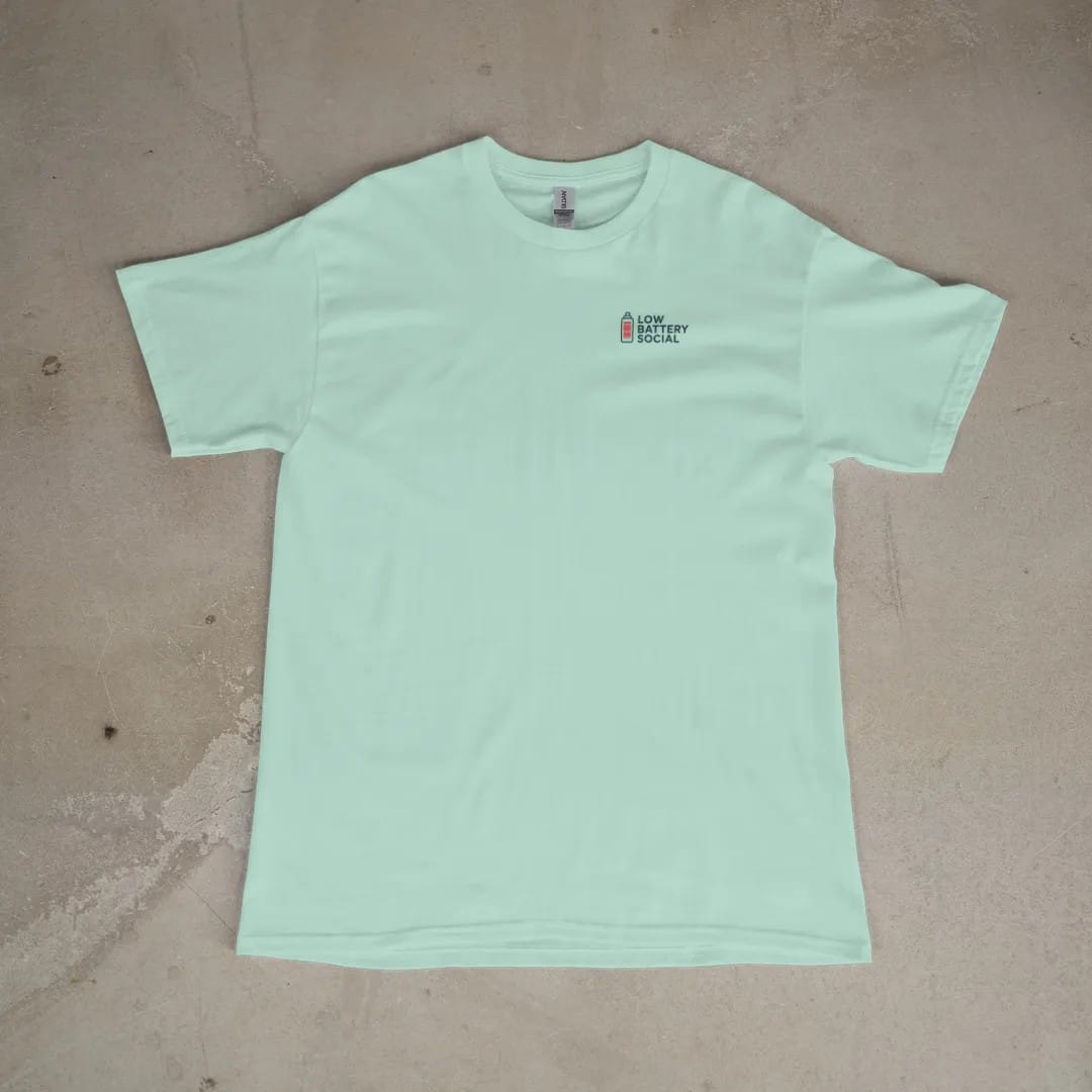 Front of a Chalky Mint tee laid flat, with the small Low Battery Social logo on the left chest.