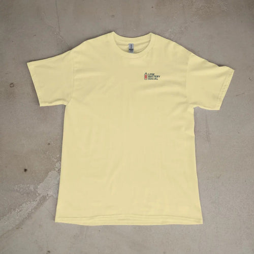 Front of a Butter tee laid flat, with the small Low Battery Social logo on the left chest.